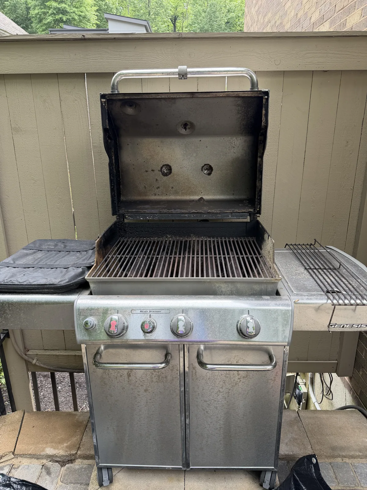 After: the same Weber Genesis with Sear Station — clean grates reinstalled, a brightened cookbox, and a wiped-down hood interior